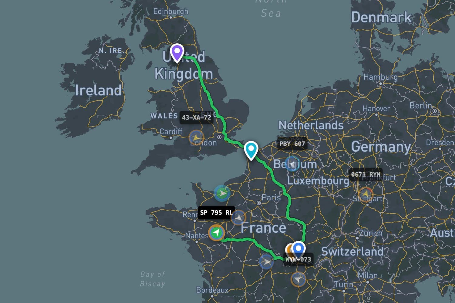 Live map with a multi-stop route from the UK across France, truck positions and stop markers.